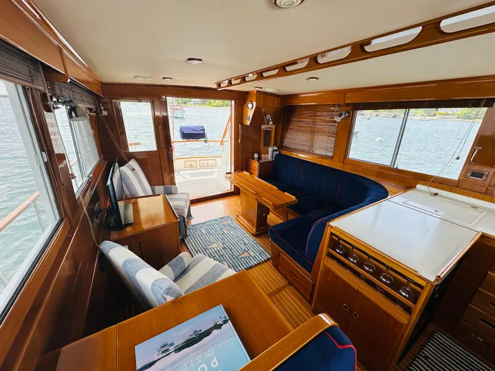 Liberty Yacht Photos Pics Luxurious interior of 2003 Grand Banks 46 Europa yacht with wood finishes and comfortable seating.