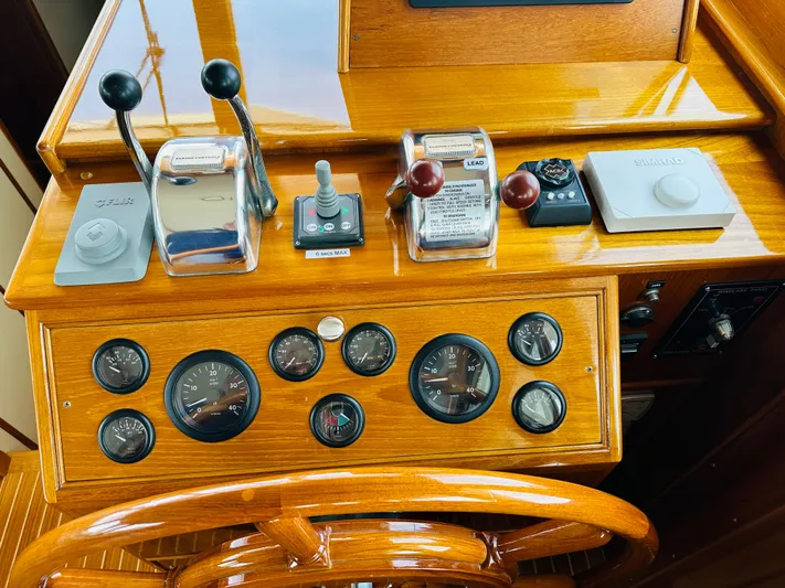 Liberty Yacht Photos Pics 2003 Grand Banks 46 Europa helm with wooden dashboard and control gauges.