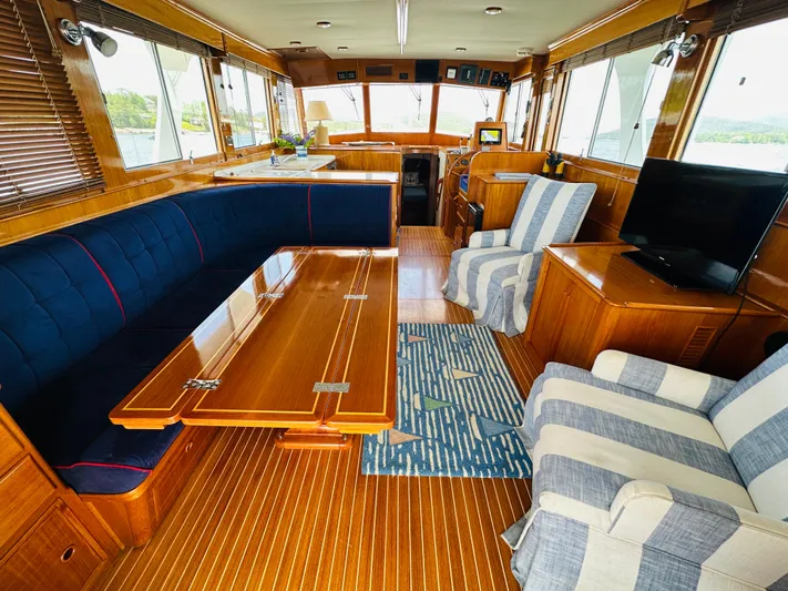 Liberty Yacht Photos Pics Luxurious interior of 2003 Grand Banks 46 Europa yacht with elegant wood finishes and comfortable seating.
