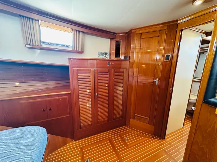 Liberty Yacht Photos Pics Interior of 2003 Grand Banks 46 Europa yacht with wooden cabinetry and flooring.