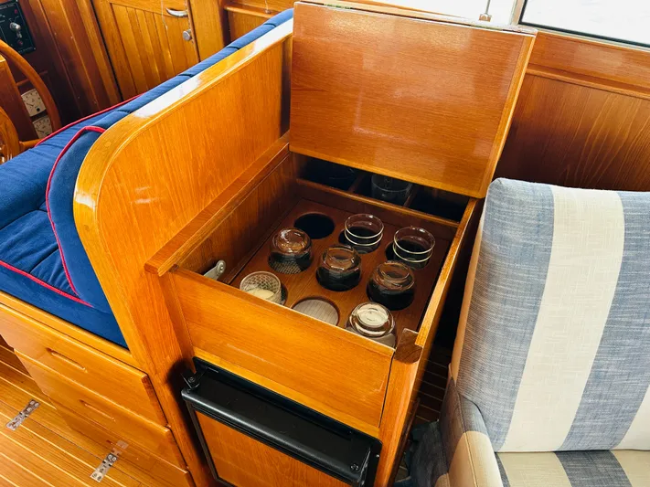 Liberty Yacht Photos Pics Wooden interior of 2003 Grand Banks 46 Europa with built-in storage and seating.