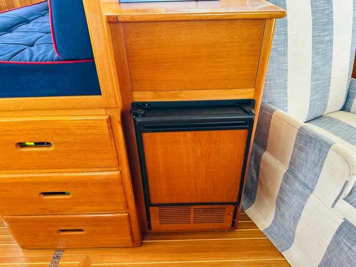 Liberty Yacht Photos Pics Wooden interior of 2003 Grand Banks 46 Europa yacht with built-in mini fridge.