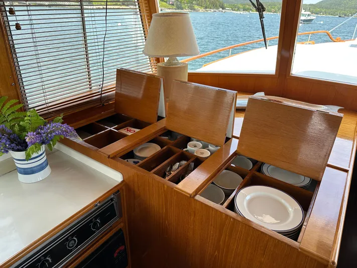 Liberty Yacht Photos Pics Galley storage on 2003 Grand Banks 46 Europa yacht with organized dish compartments.