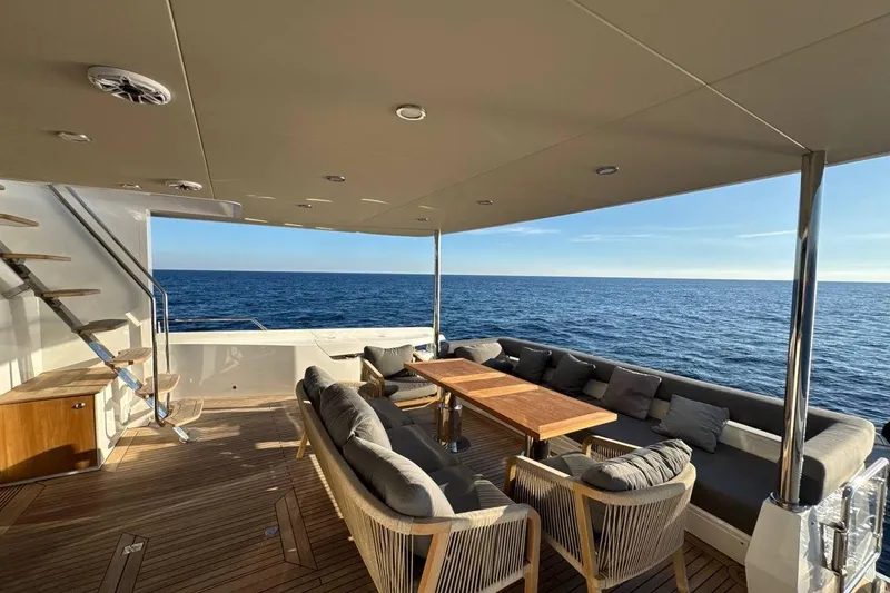 Maoria Yacht Photos Pics Luxurious 2021 Numarine 26XP yacht deck with elegant seating and ocean view.