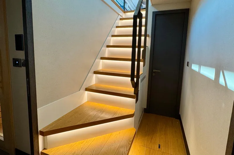 Maoria Yacht Photos Pics Modern staircase with ambient lighting on a 2021 Numarine 26XP yacht.
