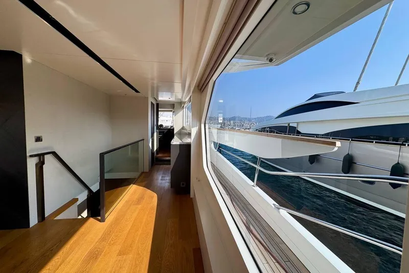 Maoria Yacht Photos Pics Luxurious interior of 2021 Numarine 26XP yacht with wooden flooring and large windows.