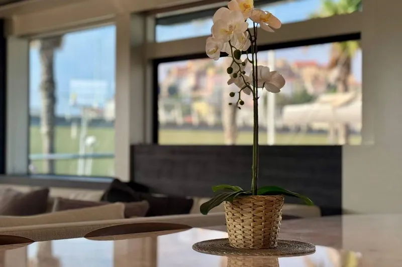 Maoria Yacht Photos Pics Elegant interior of 2021 Numarine 26XP yacht with orchid centerpiece.