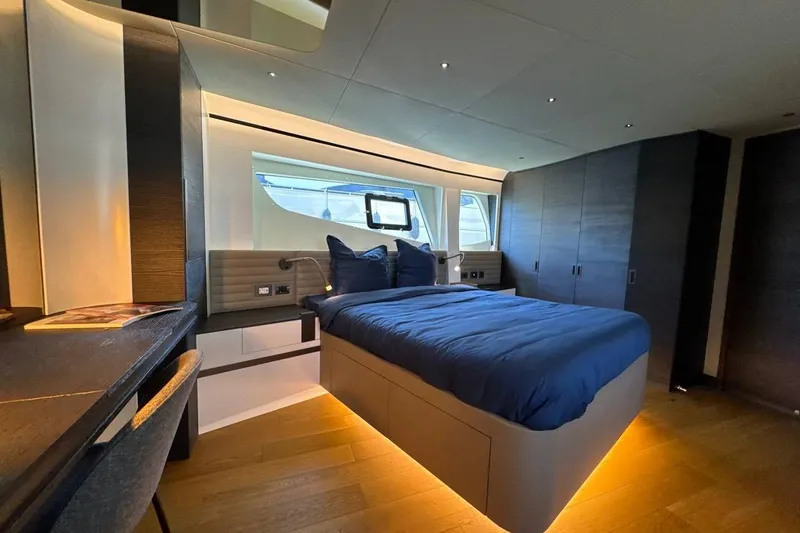 Maoria Yacht Photos Pics Luxurious bedroom interior of 2021 Numarine 26XP yacht with modern design and ambient lighting.