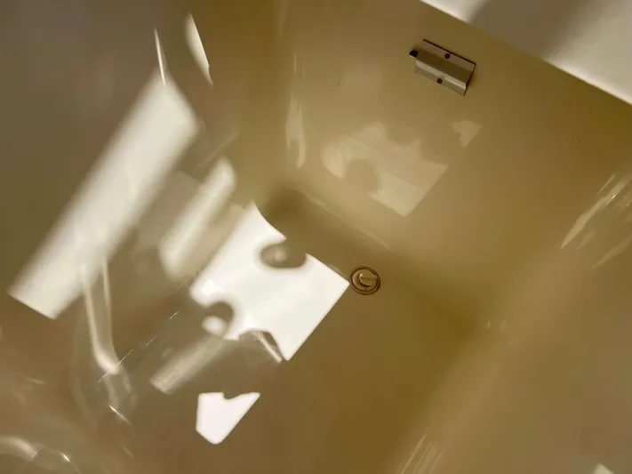  Yacht Photos Pics Interior view of a 2022 Henriques 42 Express Hardtop boat, showcasing a clean, reflective surface.