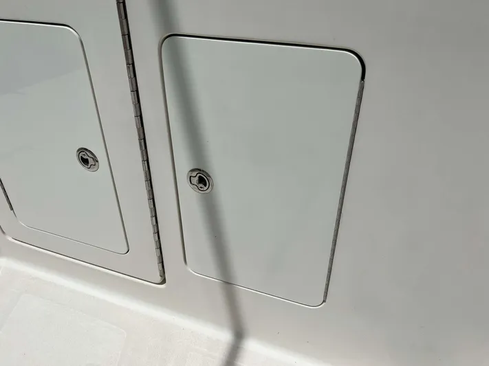  Yacht Photos Pics 2022 Henriques 42 Express Hardtop storage compartments with secure locks.