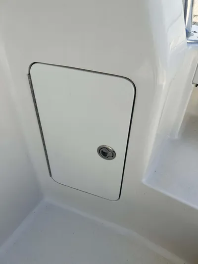  Yacht Photos Pics 2022 Henriques 42 Express Hardtop, white storage compartment with lock.
