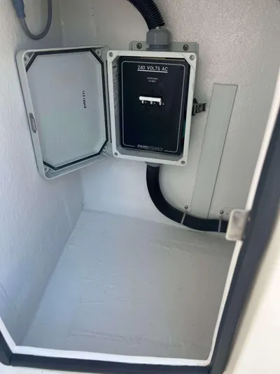  Yacht Photos Pics Electrical panel inside 2022 Henriques 42 Express Hardtop boat, featuring 240 volts AC.