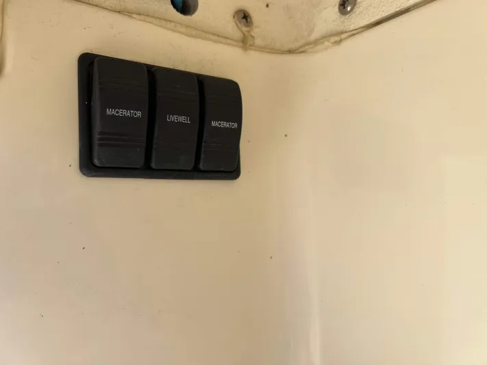  Yacht Photos Pics Switch panel on 2022 Henriques 42 Express Hardtop boat, featuring macerator and livewell controls.