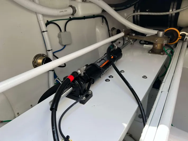  Yacht Photos Pics Engine compartment of a 2022 Henriques 42 Express Hardtop, showcasing hydraulic and plumbing systems.