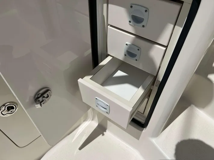  Yacht Photos Pics Open storage drawers on a 2022 Henriques 42 Express Hardtop boat.