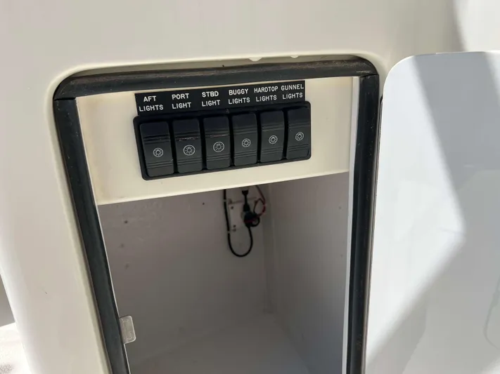  Yacht Photos Pics Control panel on a 2022 Henriques 42 Express Hardtop boat, featuring labeled light switches.