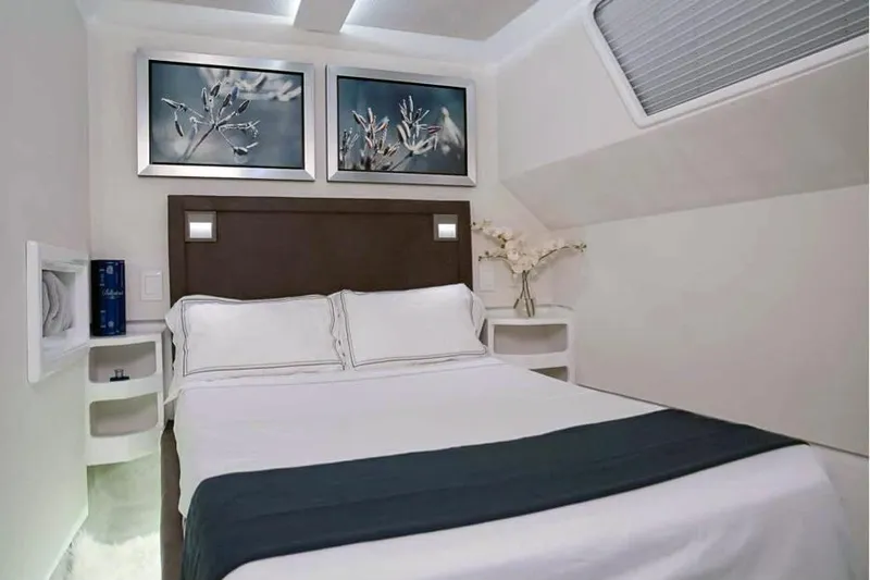  Yacht Photos Pics Luxurious bedroom in 2024 Leeuwin 55 yacht with elegant decor and modern furnishings.
