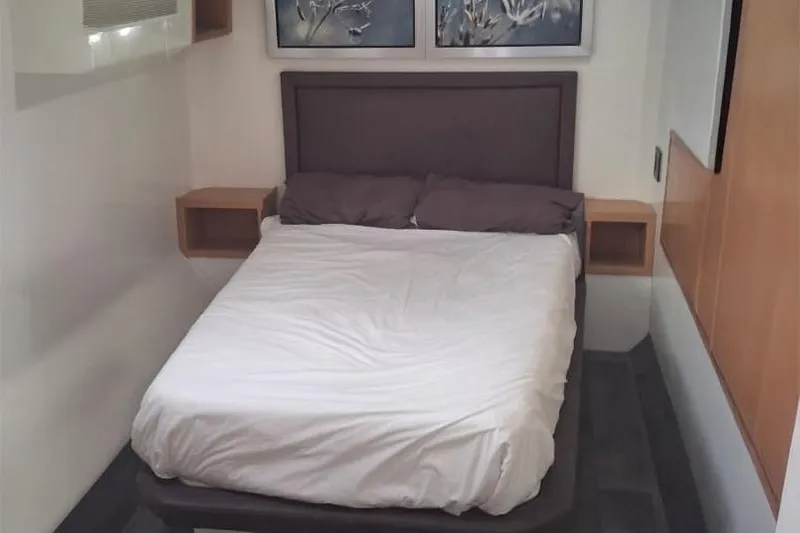  Yacht Photos Pics 2024 Leeuwin 55 interior bedroom with modern design and cozy bed.