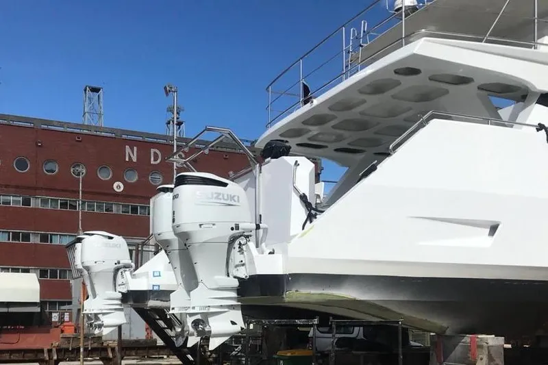 Yacht Photos Pics 2024 Leeuwin 55 yacht with Suzuki outboard motors at a shipyard.