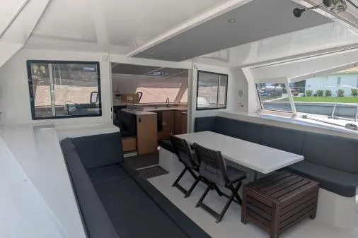 Sea Hugger Yacht Photos Pics Spacious interior of 2016 Nautitech 40 Open catamaran with modern seating and dining area.