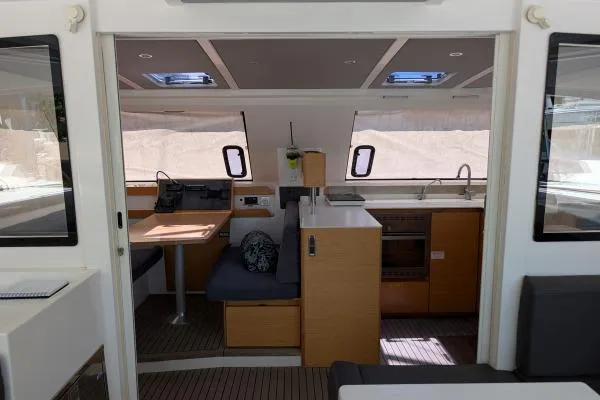 Sea Hugger Yacht Photos Pics Interior of 2016 Nautitech 40 Open catamaran, featuring modern kitchen and seating area.