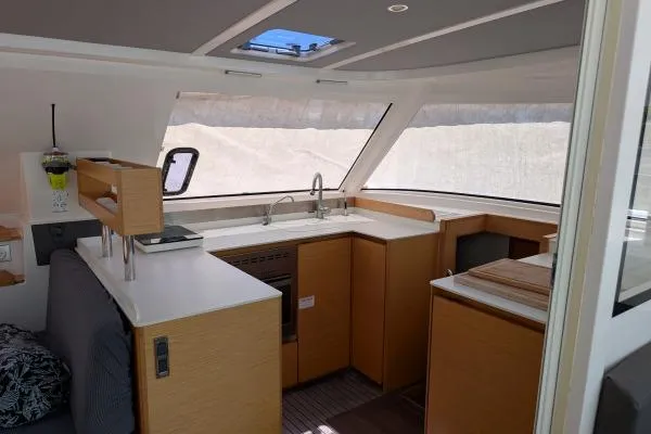 Sea Hugger Yacht Photos Pics Interior of 2016 Nautitech 40 Open catamaran with modern kitchen and panoramic windows.
