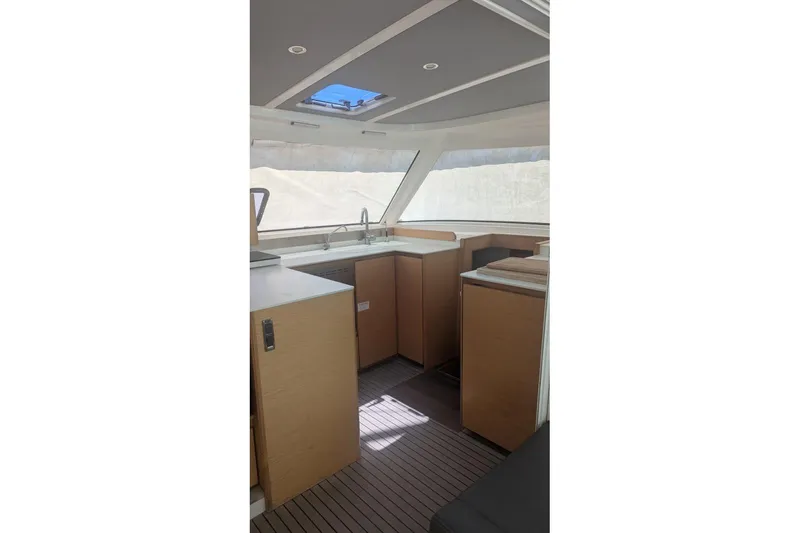 Sea Hugger Yacht Photos Pics Interior of 2016 Nautitech 40 Open catamaran, featuring modern kitchen and sleek design.