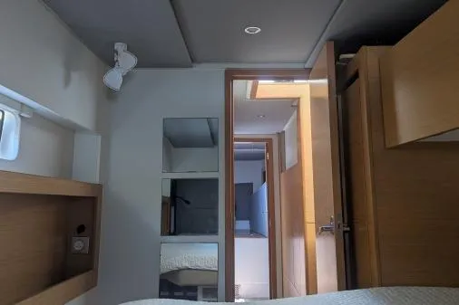 Sea Hugger Yacht Photos Pics Interior of 2016 Nautitech 40 Open catamaran, featuring modern wood finishes and cozy cabin space.