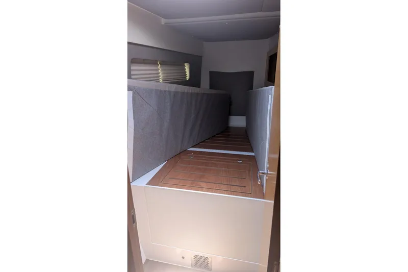 Sea Hugger Yacht Photos Pics Interior cabin of 2016 Nautitech 40 Open catamaran with wooden flooring and cushioned seating.