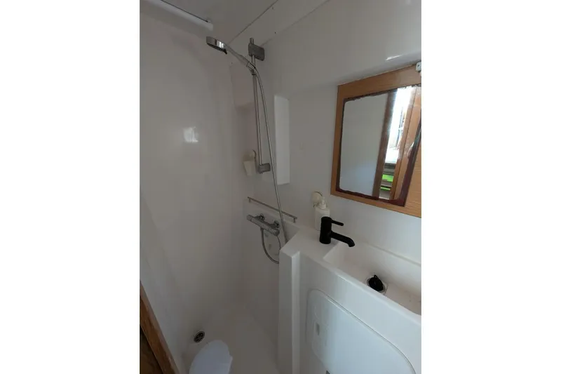 Sea Hugger Yacht Photos Pics Compact bathroom in 2016 Nautitech 40 Open yacht with shower and sink.