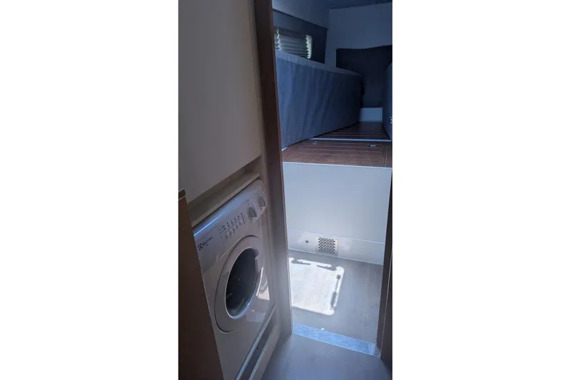 Sea Hugger Yacht Photos Pics Interior of 2016 Nautitech 40 Open catamaran with washing machine and cozy sleeping area.