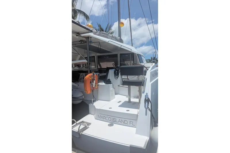 Sea Hugger Yacht Photos Pics 2016 Nautitech 40 Open catamaran docked at Marco Island, Florida, under a sunny sky.