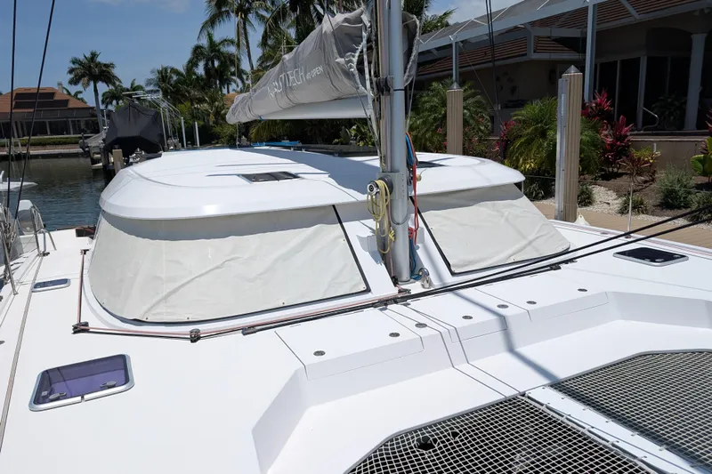 Sea Hugger Yacht Photos Pics 2016 Nautitech 40 Open catamaran docked, featuring sleek design and spacious deck.