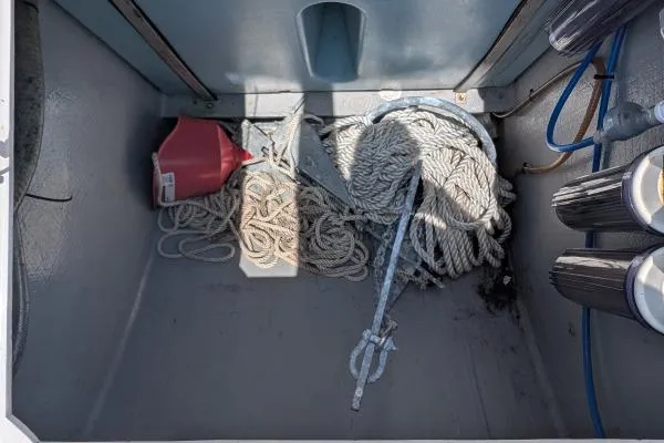 Sea Hugger Yacht Photos Pics Storage compartment on a 2016 Nautitech 40 Open, featuring ropes, anchor, and funnel.