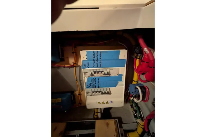 Sea Hugger Yacht Photos Pics Electrical panel on a 2016 Nautitech 40 Open catamaran with labeled circuit breakers.