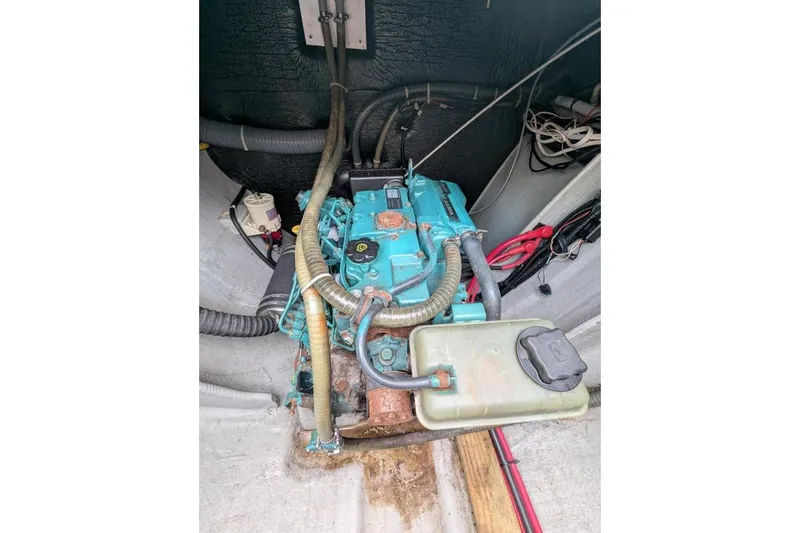 Sea Hugger Yacht Photos Pics Engine compartment of a 2016 Nautitech 40 Open catamaran, featuring visible hoses and wiring.