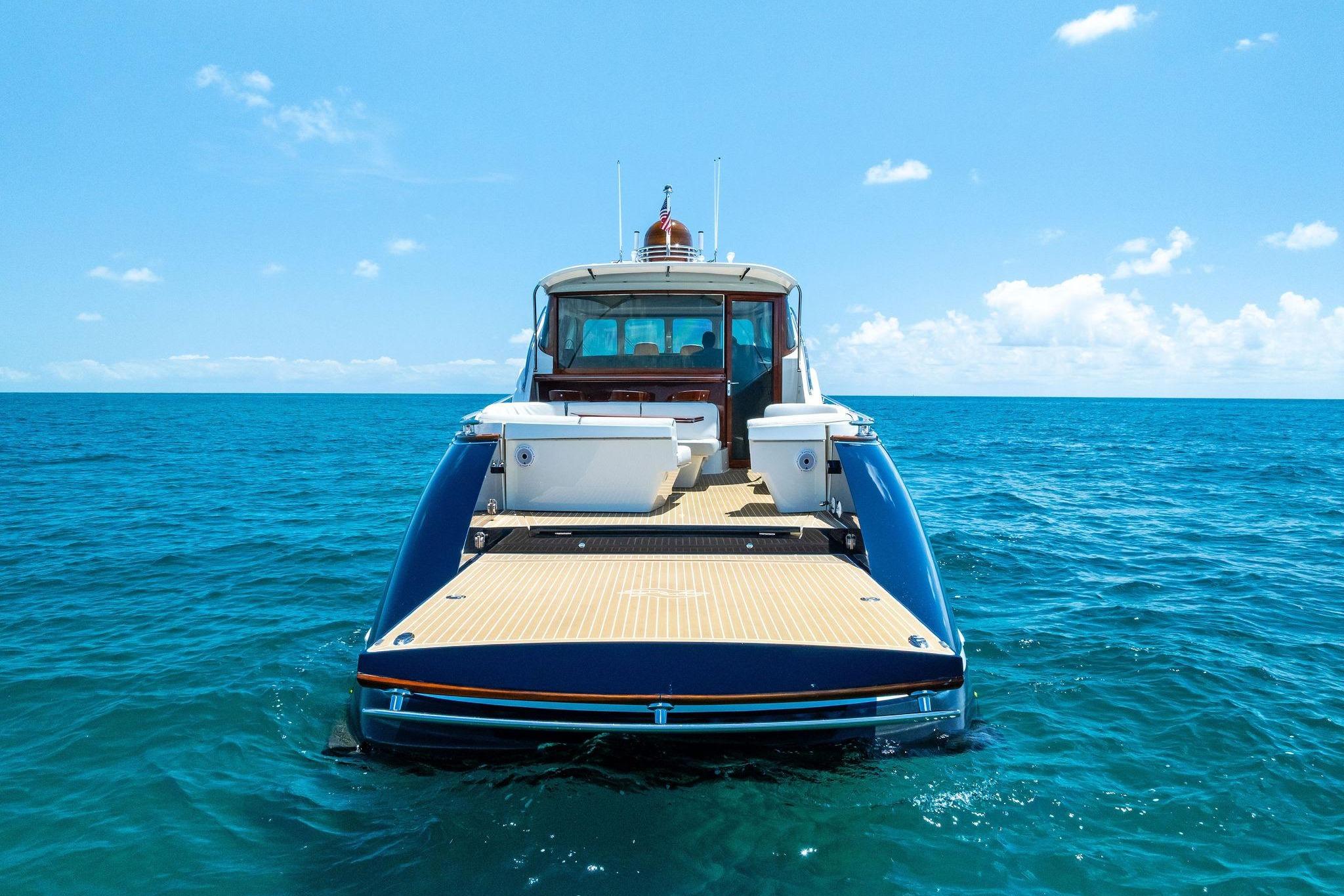 2019 Zeelander Z55 yacht on open sea, rear view, clear blue sky.