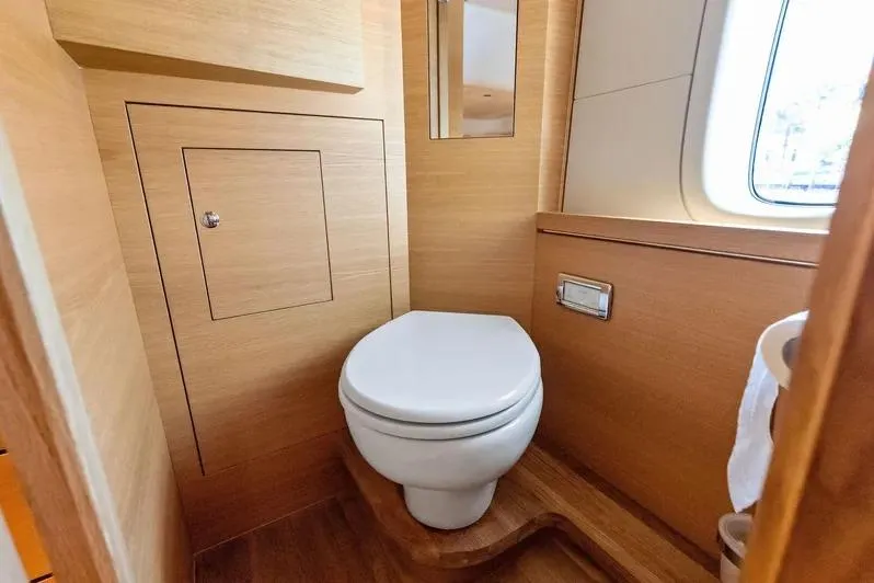 Dutch Yacht Photos Pics Luxurious 2019 Zeelander Z55 yacht bathroom with wooden interior and modern toilet design.