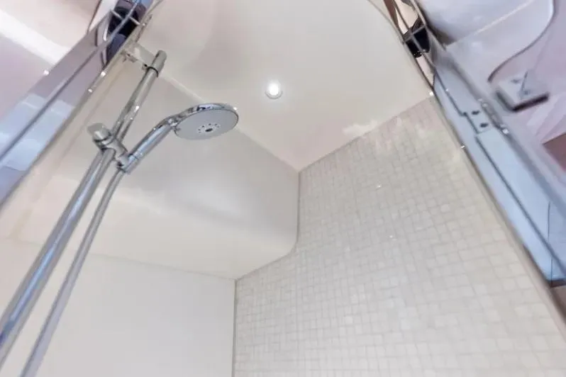Dutch Yacht Photos Pics Shower area in 2019 Zeelander Z55 yacht with modern fixtures and tiled walls.