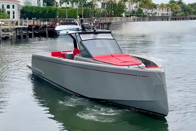 Odessa Mama Yacht Photos Pics 2023 Pardo Yachts 43 in sleek gray with red accents cruising on calm water.