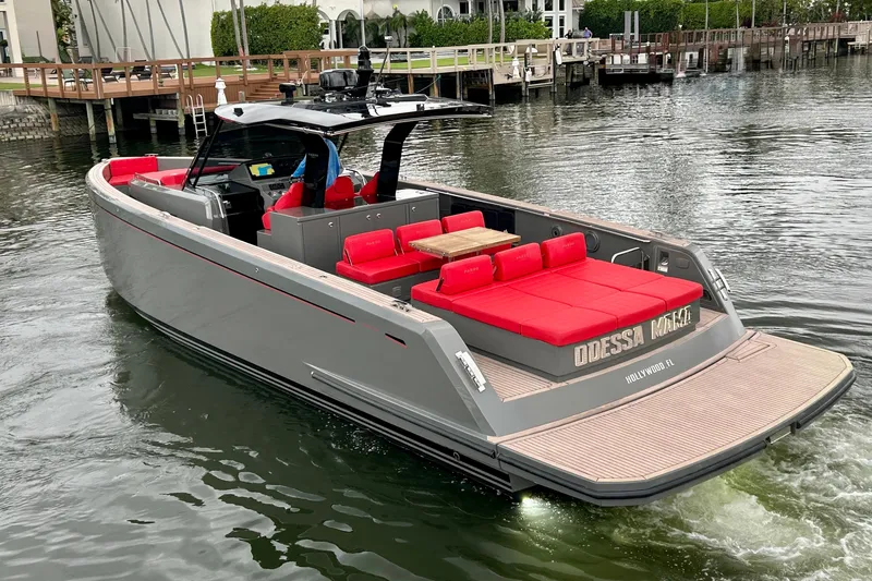 Odessa Mama Yacht Photos Pics 2023 Pardo Yachts 43 with red seating, cruising in a marina.