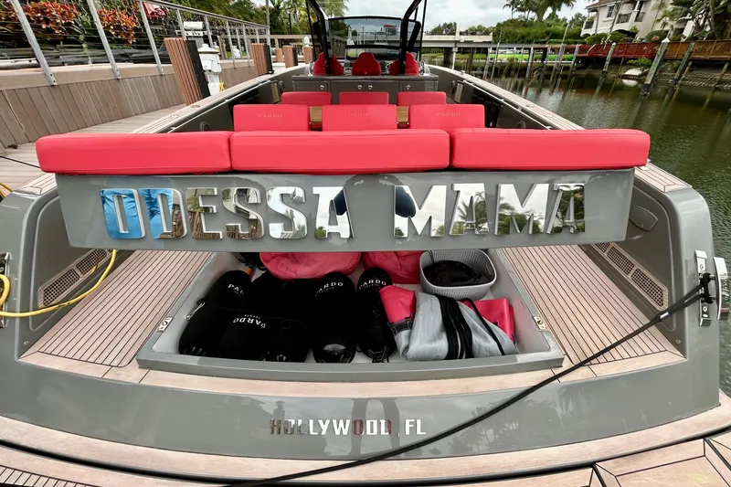 Odessa Mama Yacht Photos Pics 2023 Pardo Yachts 43 docked, featuring red seating and "Odessa Mama" nameplate.