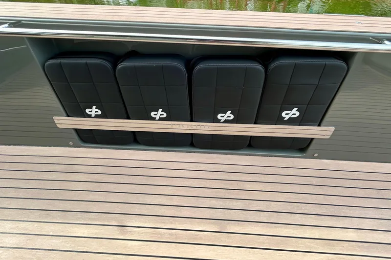 Odessa Mama Yacht Photos Pics 2023 Pardo Yachts 43, sleek black seating with logo, on wooden deck.