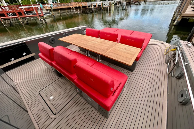 Odessa Mama Yacht Photos Pics Luxury Pardo Yachts 43, 2023 model, featuring red seating and wooden table on deck.