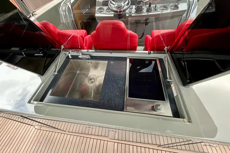 Odessa Mama Yacht Photos Pics Luxury Pardo Yachts 43 interior with sleek kitchen sink and red seating, 2023 model.