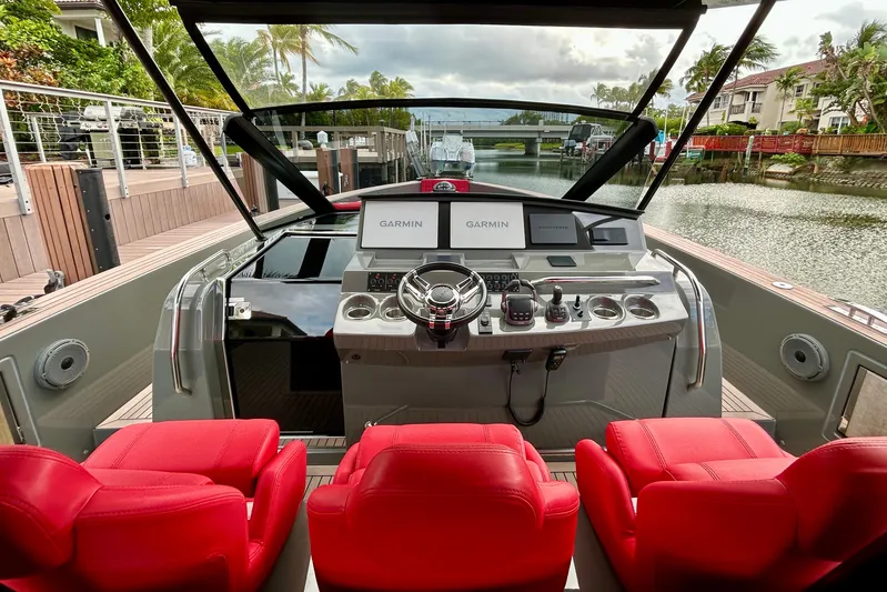 Odessa Mama Yacht Photos Pics 2023 Pardo Yachts 43 cockpit with red seats and advanced navigation system.