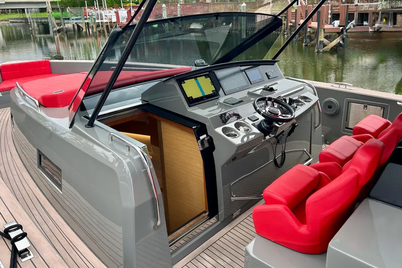 Odessa Mama Yacht Photos Pics 2023 Pardo Yachts 43 cockpit with red seats and modern navigation controls.