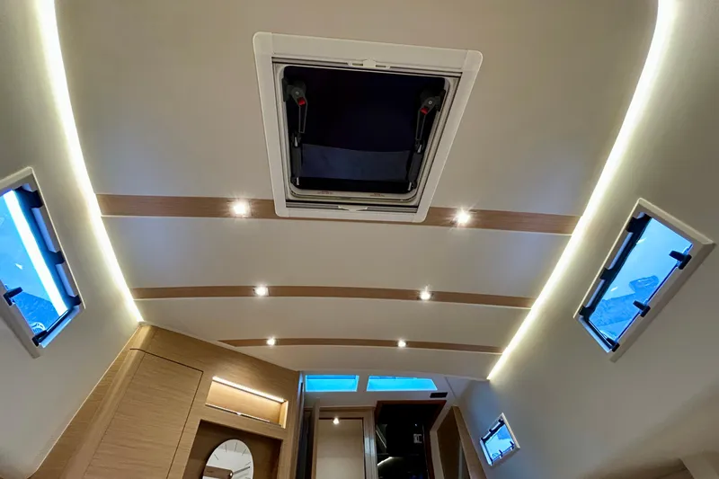 Odessa Mama Yacht Photos Pics Luxurious interior of 2023 Pardo Yachts 43 with modern lighting and windows.