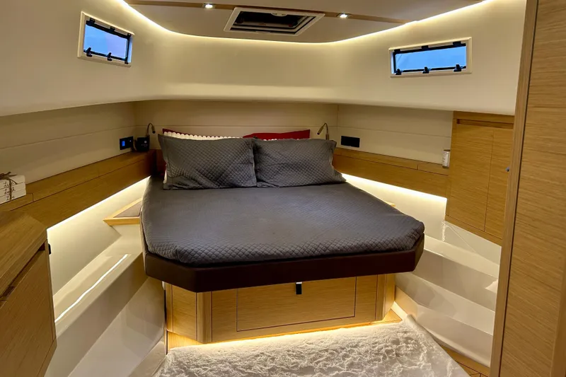 Odessa Mama Yacht Photos Pics Luxurious cabin interior of 2023 Pardo Yachts 43, featuring a cozy bed and modern design.