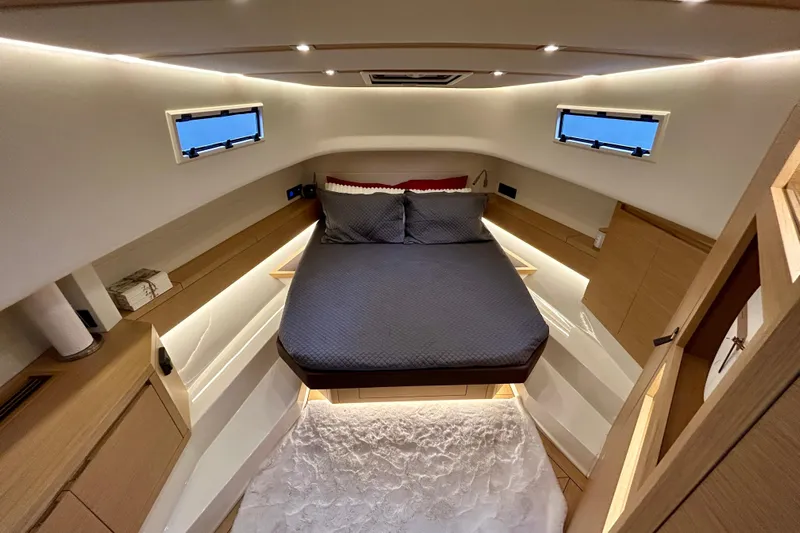 Odessa Mama Yacht Photos Pics Luxurious cabin interior of 2023 Pardo Yachts 43, featuring modern design and cozy bedding.
